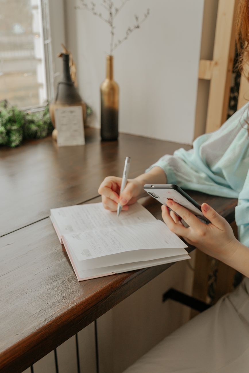Editorial team member journaling in natural light